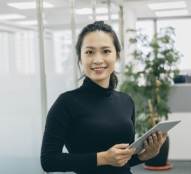 young professional women shown with a tablet