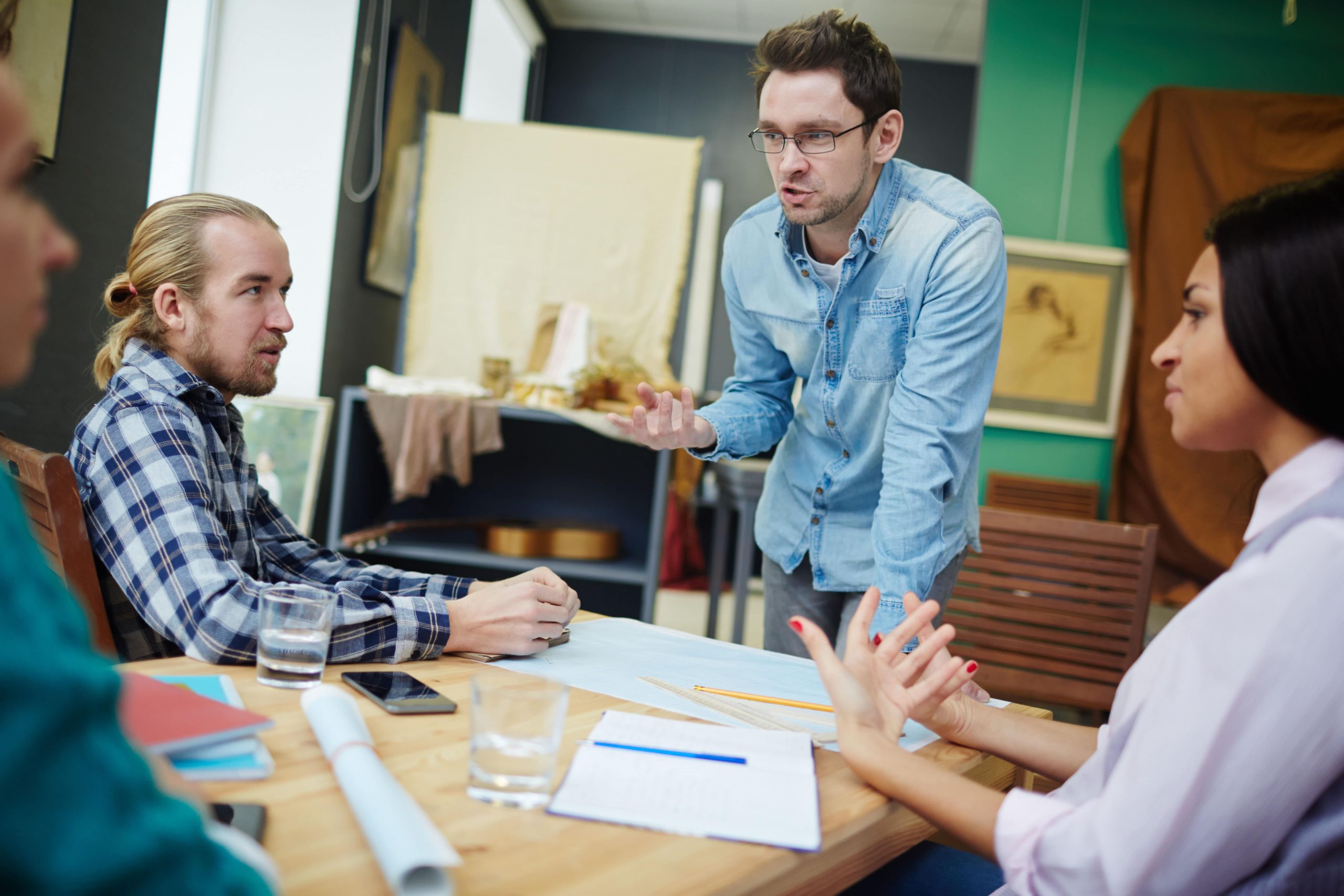 a few millennial workers pictures having a creative meeting